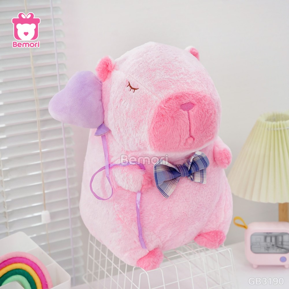 ĐG 40cm Gấu Bông Capybara Hồng Cầm Bóng Tim cài nơ xinh yêu