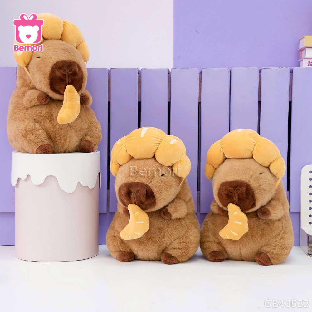 Gấu Bông Capybara Đội Bánh Sừng Bò