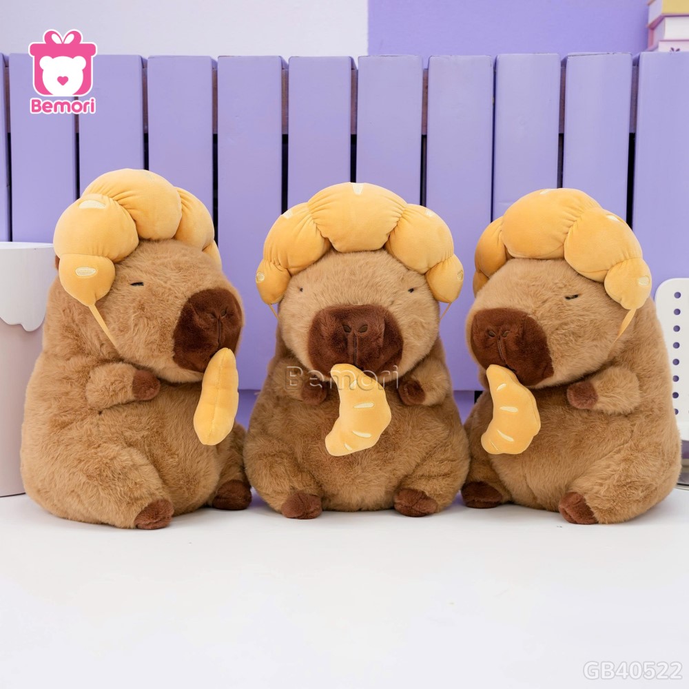 Gấu Bông Capybara Đội Bánh Sừng Bò