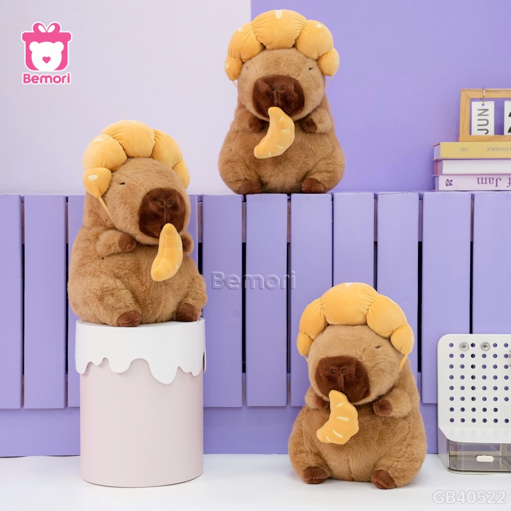 Gấu Bông Capybara Đội Bánh Sừng Bò