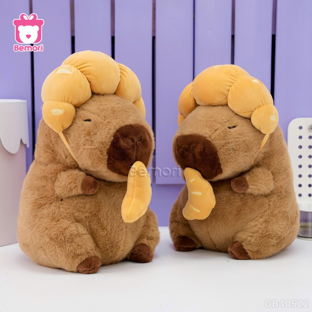 Gấu Bông Capybara Đội Bánh Sừng Bò