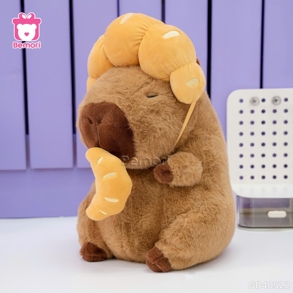 Gấu Bông Capybara Đội Bánh Sừng Bò