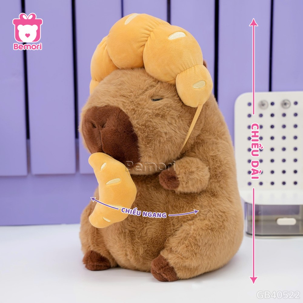 Gấu Bông Capybara Đội Bánh Sừng Bò