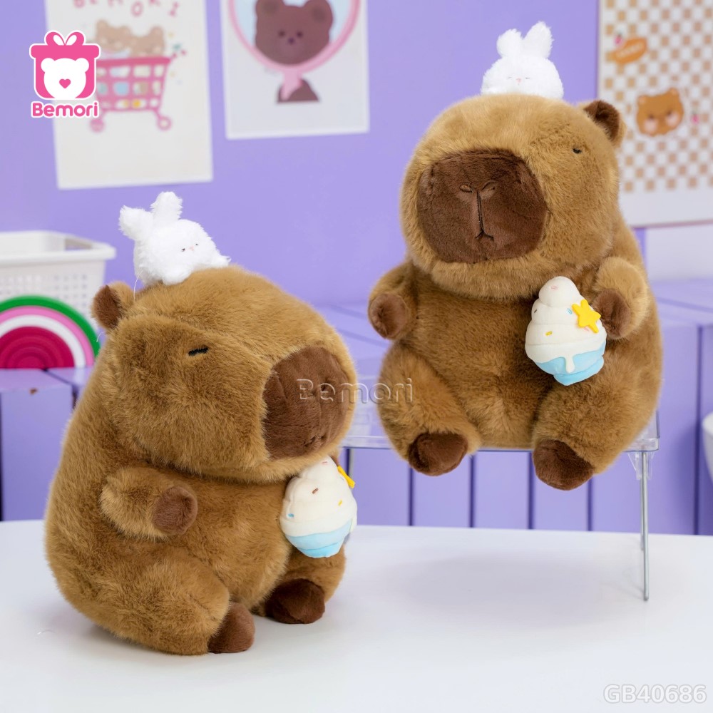 Gấu Bông Capybara Ôm Kem Đội Thỏ