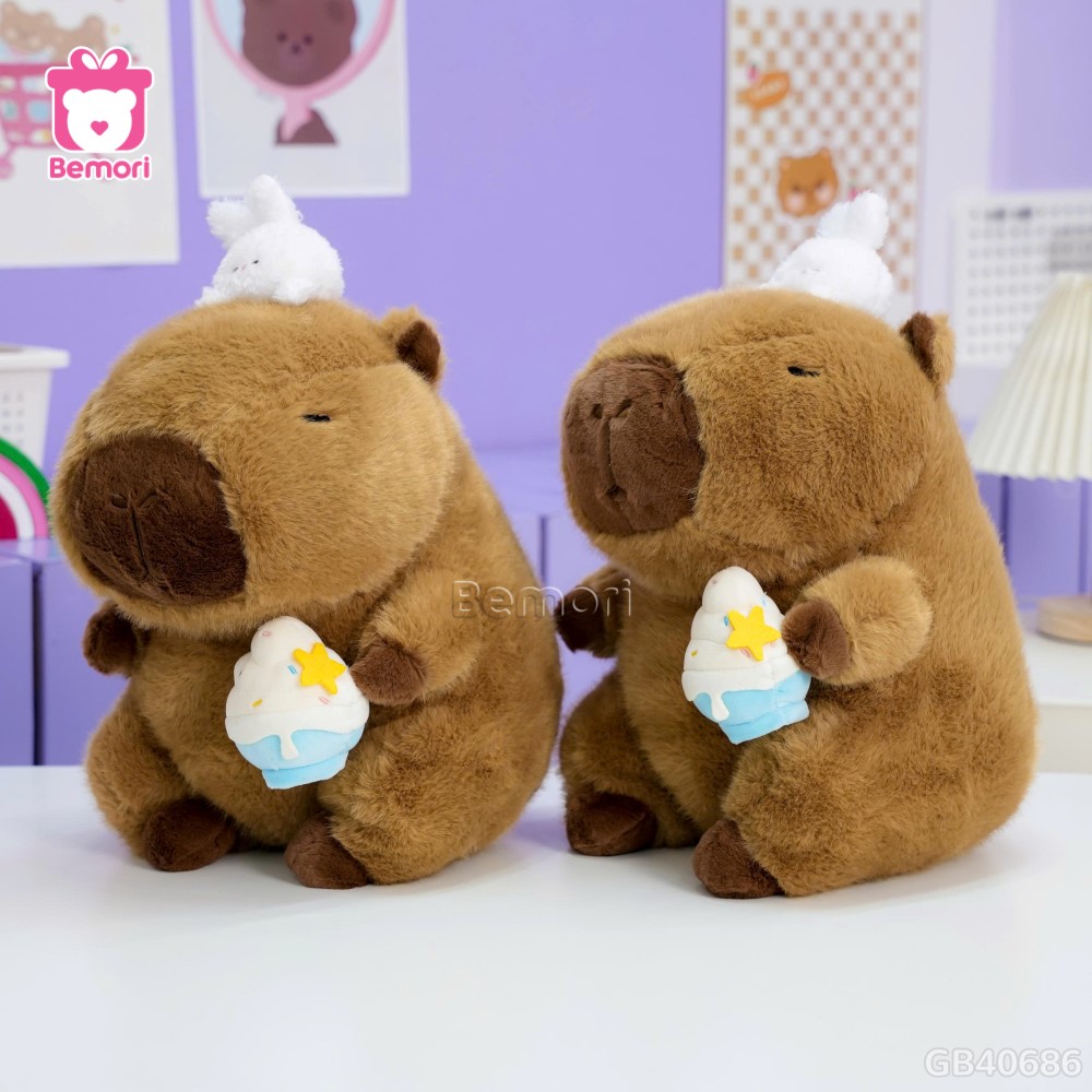 Gấu Bông Capybara Ôm Kem Đội Thỏ