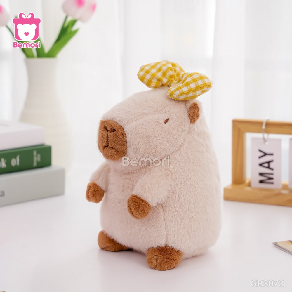 Gấu Bông Capybara Đeo Nơ Kẻ – Kem