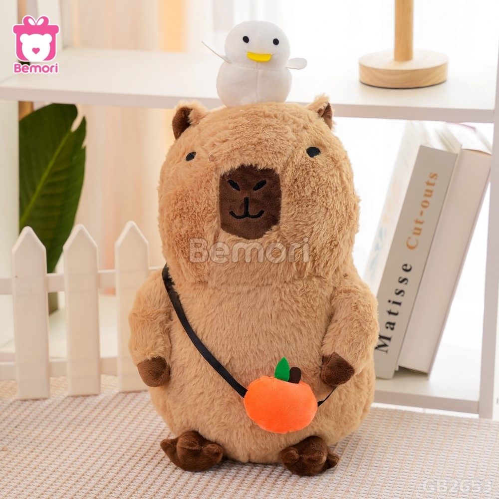 Gấu Bông Capybara Đội Vịt Đeo Túi Quả Cam dễ thương