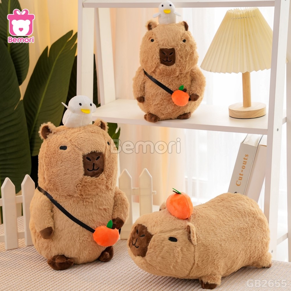 Gấu Bông Capybara Nằm Đội Quả Cam