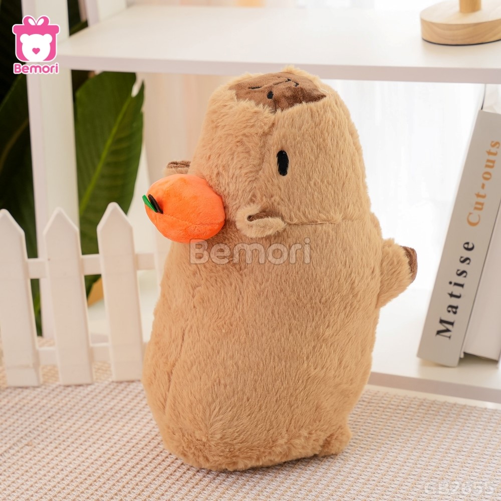 Gấu Bông Capybara Nằm Đội Quả Cam