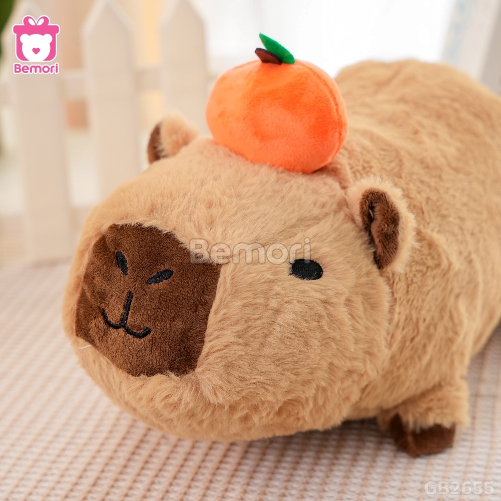 Gấu Bông Capybara Nằm Đội Quả Cam